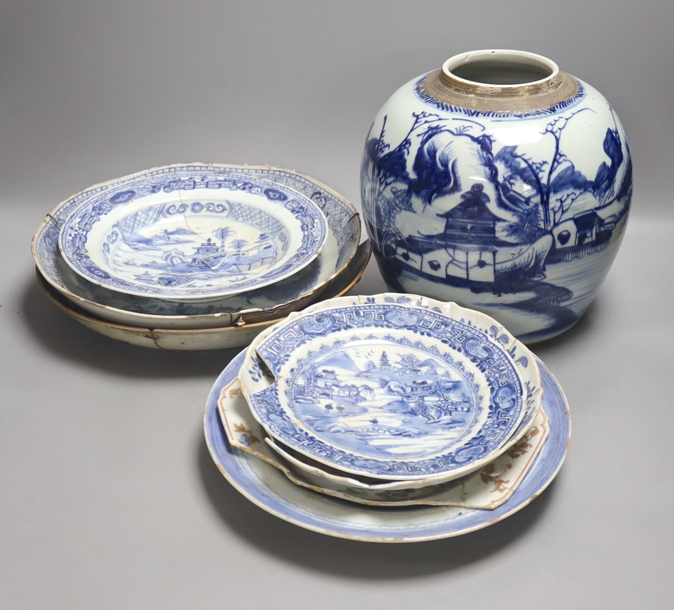 A group of 18th century Chinese export blue and white dishes, plates and a jar, the jar 21.5cm high